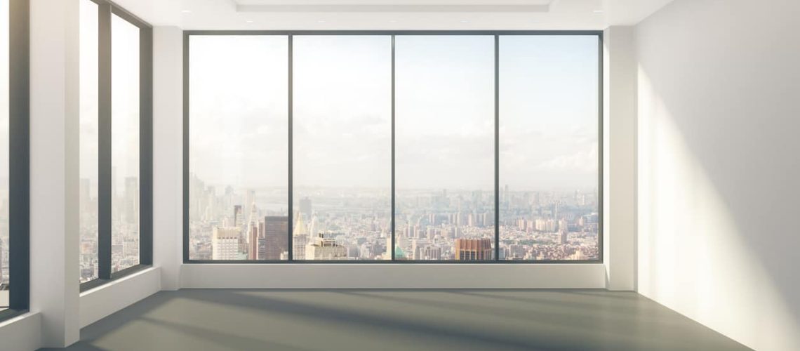 Modern empty room with windows in floor and city view